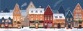 Winter city with houses in snow, decorated for Christmas. Empty street of Europe town with home buildings, lights in Royalty Free Stock Photo