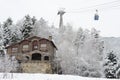 Winter city landscape - trees building and ski lift in the snow, La Massana, Principality of Andorra, Europe. Royalty Free Stock Photo