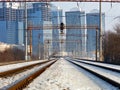 Winter cityscape electric train moving on rails central perspective