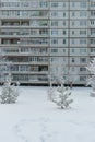 Winter cityscape, facade of an apartment building in Russia