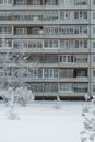 Winter cityscape, facade of an apartment building in Russia. Vertical photo