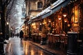 Winter cityscape snow covered streets of Paris lined with historical buildings adorned with festive lights and Royalty Free Stock Photo