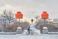 Winter cityscape of Yekaterinburg, Russia. Two cozy home orange lampshades on lanterns on city alley