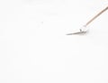 Man shoveling snow at a footpath Royalty Free Stock Photo