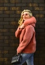 Winter clothes. Fashion as unique as you are. Pink sheepskin coat. Fancy chic coat. Natural wool sheepskin coat. Fur on