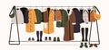 Winter clothes on racks. Men and women fashionable outfits for autumn and spring, trendy fashionable store with variety Royalty Free Stock Photo