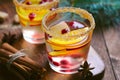 Winter Cocktail, Christmas Sangria with Apple Slices, Orange, Cranberry and Spices, Refreshing Drink Royalty Free Stock Photo