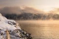 Winter cold foggy dawn on the Yenisei river