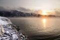 Winter cold foggy dawn on the Yenisei river