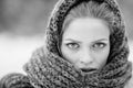 Young and blond girl wearing blue scarf in winter Royalty Free Stock Photo