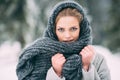 Young and blond girl wearing blue scarf in winter Royalty Free Stock Photo