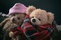 Winter, cold weather, love. Couple teddy bears sitting on a snowed bench, closeup view