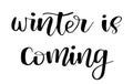 Winter is coming. Brush painted hand lettering inscription to winter holiday greeting card, Christmas banner calligraphy text quot
