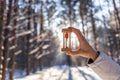 Hourglass in the snow. Spring is coming. melting snow Royalty Free Stock Photo