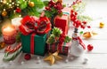 Winter composition with Christmas gift boxes, holiday sweets and Christmas decorations on wooden table