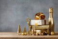 Winter composition with Christmas gift or present boxes and golden holiday decorations on wooden background. Greeting card. Royalty Free Stock Photo