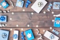 Winter composition with copy space. Small gift boxes decorated with bows, ribbons and snowflakes ribbons beautifully Royalty Free Stock Photo