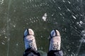 In winter Concept Man wear hiking boots standing on a frozen ice rive covered snow Royalty Free Stock Photo
