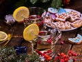 Winter cookies plate and two punch glasses mug with berries. Royalty Free Stock Photo