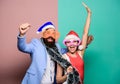 Winter corporate party. Office christmas party. Happy man and woman wear santa hats and funny sunglasses. Manager tinsel Royalty Free Stock Photo