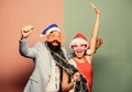 Winter corporate party. Office christmas party. Happy man and woman wear santa hats and funny sunglasses. Manager tinsel Royalty Free Stock Photo