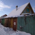 winter country house snowy with beautiful flower gate Royalty Free Stock Photo