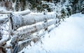 Winter country landscape with frozen timber - wooden fence. Royalty Free Stock Photo