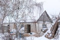 Winter countryside landscape, dilapidated abandoned ruined building covered in snow Royalty Free Stock Photo