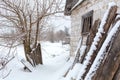 Winter countryside landscape, dilapidated abandoned ruined building covered in snow Royalty Free Stock Photo