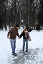 Winter couple activities. Winter Date Ideas to Cozy Up. Cold season dates for couples. Young couple in love waking Royalty Free Stock Photo