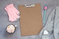 Winter cozy clipping board mockup, banner. Coffee with marshmallows, knitted sweater, white heart, pen with cap and pink gloves on