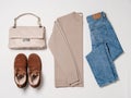 Winter cozy fashion flat lay with sweater, jeans, boots