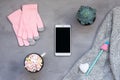 Winter cozy mockup, banner. White smartphone, Coffee with marshmallows, knitted sweater, white heart, pen with cap and pink gloves