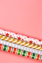 Winter creative layot. gift wrapping paper on a pink background. minimalistic christmas scandy background with empty place for