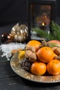 Winter cristmas fruits and nuts on silver plate Royalty Free Stock Photo