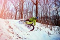 Winter cycling. Extreme riding on a mtb, mountain bicycle in the snow in the winter forest Royalty Free Stock Photo
