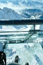 Winter Dachstein mountain massif through the glass floor. Royalty Free Stock Photo