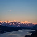 Winter dawn landscape over the Millstatter See in Carinthia, Austria, full moon