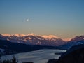 Winter dawn landscape over the Millstatter See in Carinthia, Austria, full moon