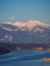 Winter dawn landscape over the Millstatter See in Carinthia, Austria, full moon