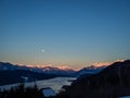 Winter dawn landscape over the Millstatter See in Carinthia, Austria, full moon
