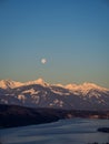 Winter dawn landscape over the Millstatter See in Carinthia, Austria, full moon