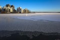 Winter day in Scandinavia, Frost covered ice of frozen lake Malaren, view of Lillaudden residential area on lake front