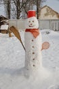 Winter day and snowman in the garden Royalty Free Stock Photo