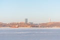 View of the city, which stands on the shore of the sea bound by ice