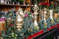 Winter decor. Beautiful arrangement of golden chess pieces, natural spruce branches, golden cones for luxury Christmas New Year