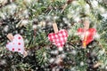 Winter decoration with red hearts on xmas fir tree