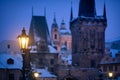 Winter detail of a lit lamp during dusk Royalty Free Stock Photo