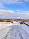 Winter dirt road in a Russian village