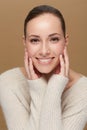Winter doesnt have to mean dry skin. Cropped portrait of a smiling young woman touching her face. Royalty Free Stock Photo